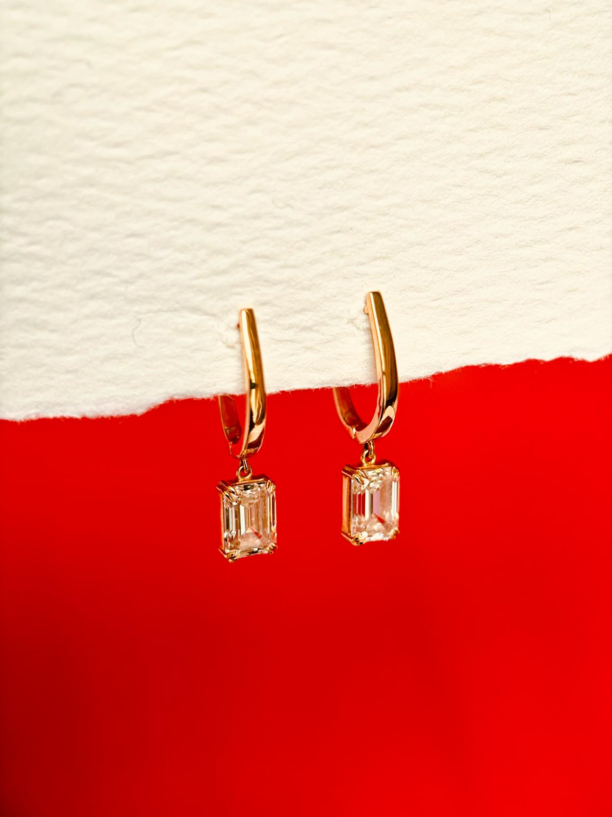 18k yellow gold huggie earrings with emerald-cut diamond drops, custom fine jewelry by Kalakari