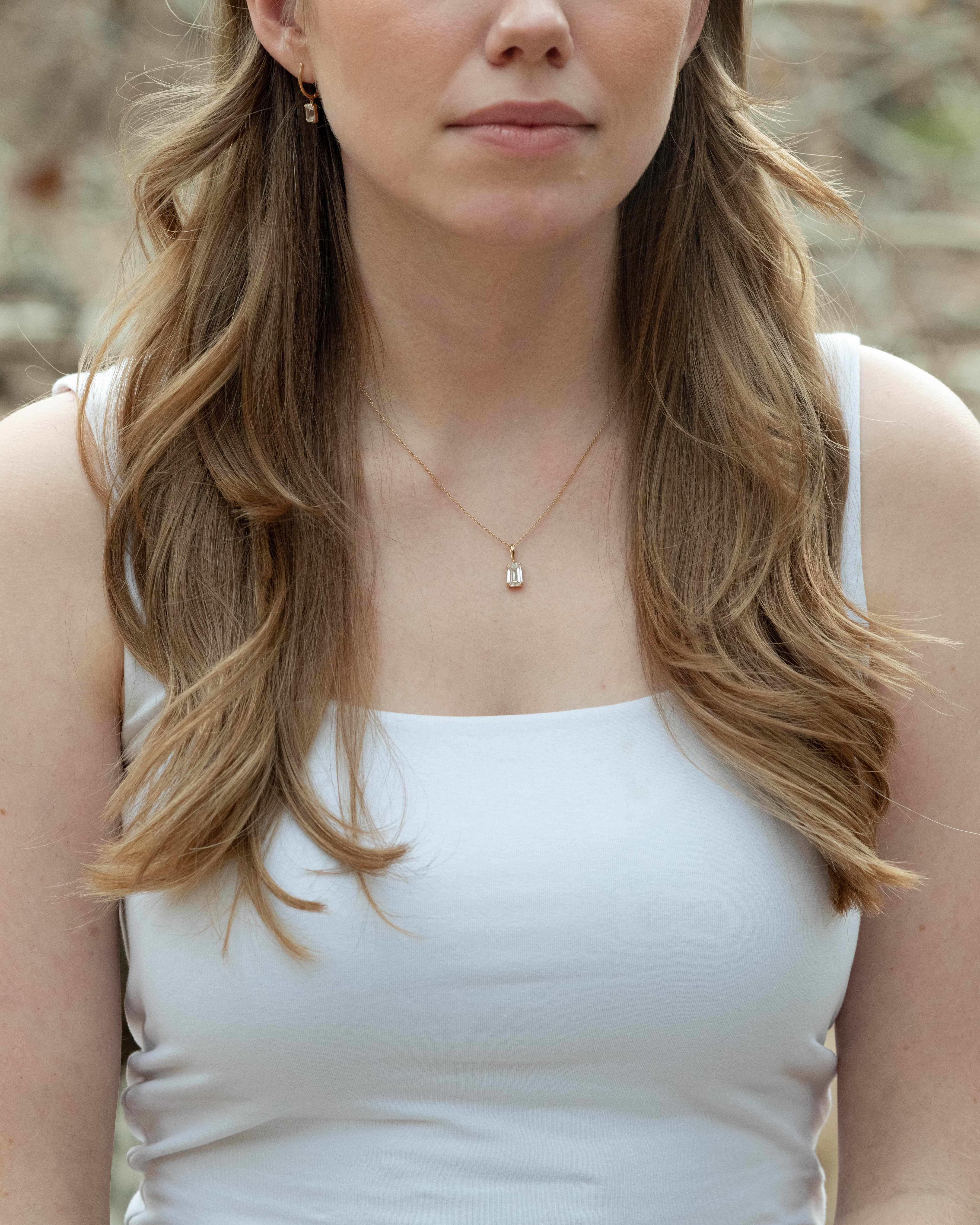 woman wearing custom diamond pendant and earrings designed online by Kalakari — custom jewelry designer online