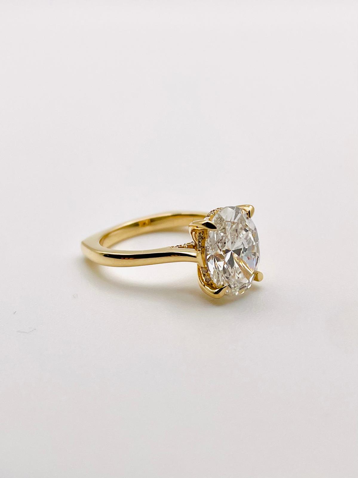 custom oval diamond solitaire engagement ring in 14k yellow gold — bespoke fine jewelry by Kalakari